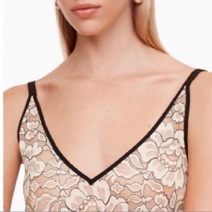 Two Aritzia Babaton lace tops
